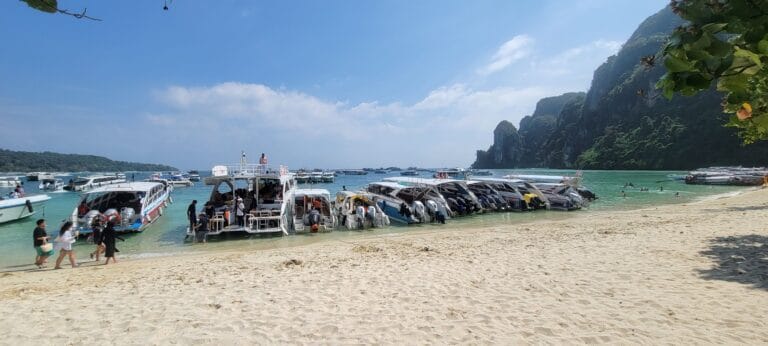 Tourist Packed Side by Side on a Beach In Thailand