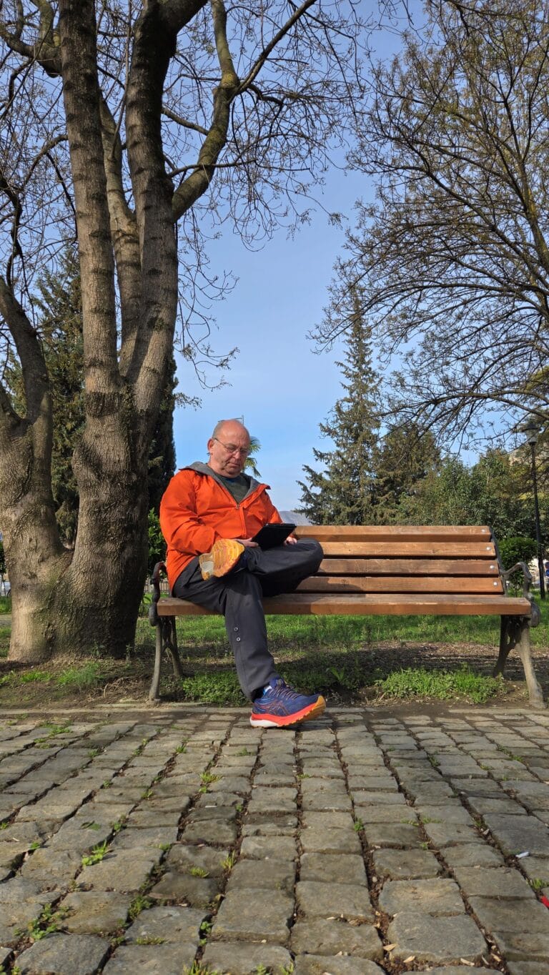 Reading In A Public Park In Albania.