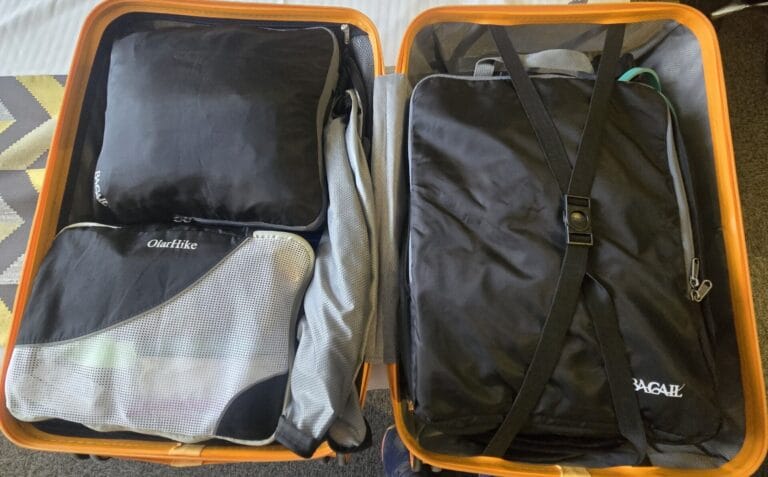 Neatly Packed Suitcase Using Packing Cubes and Compression Bags
